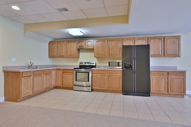 121 Rose Dr, Bloomingdale, IL 60108 - kitchen with appliances with stainless steel finishes, light countertops, and light tile patterned floors