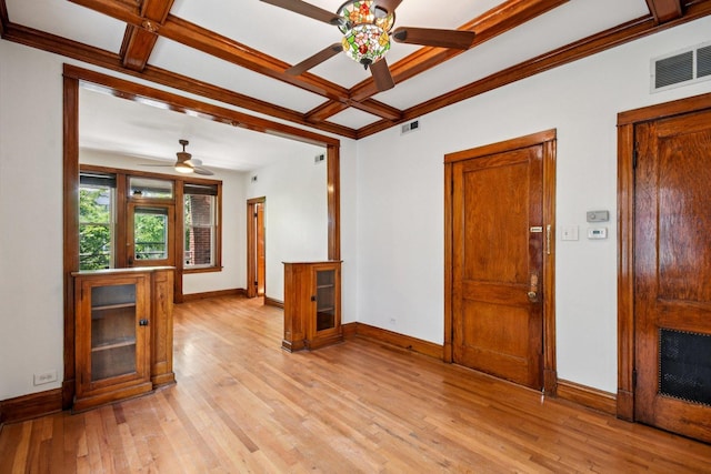 2638 W Rice St Unit 2S, Chicago, IL 60622 - spare room featuring ceiling fan, coffered ceiling, light wood-type flooring, a fireplace, and beam ceiling