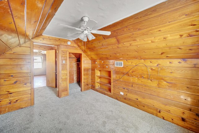 14528 Grant St, Dolton, IL 60419 - bonus room featuring vaulted ceiling, wood walls, carpet floors, and a ceiling fan
