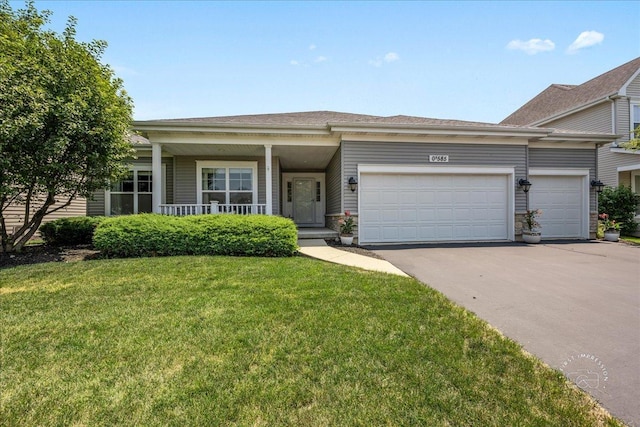 0N585 Charlotte Dr, Geneva, IL 60134 - view of front of property with an attached garage, asphalt driveway, a front yard, and covered porch