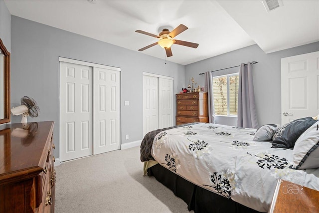 0N585 Charlotte Dr, Geneva, IL 60134 - bedroom with two closets, carpet floors, and a ceiling fan