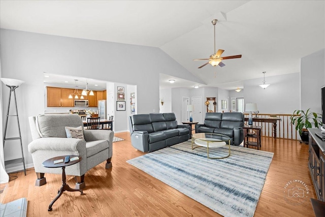 0N585 Charlotte Dr, Geneva, IL 60134 - living area with ceiling fan, light wood-style floors, and high vaulted ceiling