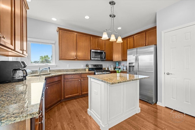 0N585 Charlotte Dr, Geneva, IL 60134 - kitchen featuring stainless steel appliances, light wood-style flooring, brown cabinets, and recessed lighting