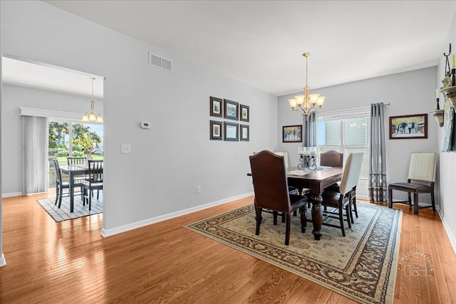 0N585 Charlotte Dr, Geneva, IL 60134 - dining area with a chandelier, healthy amount of natural light, and light wood-style flooring