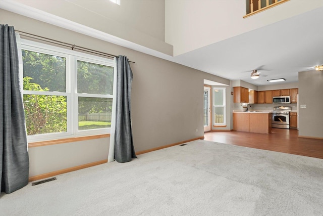 179 Briarcliff Ct, Romeoville, IL 60446 - unfurnished living room with carpet flooring and ceiling fan