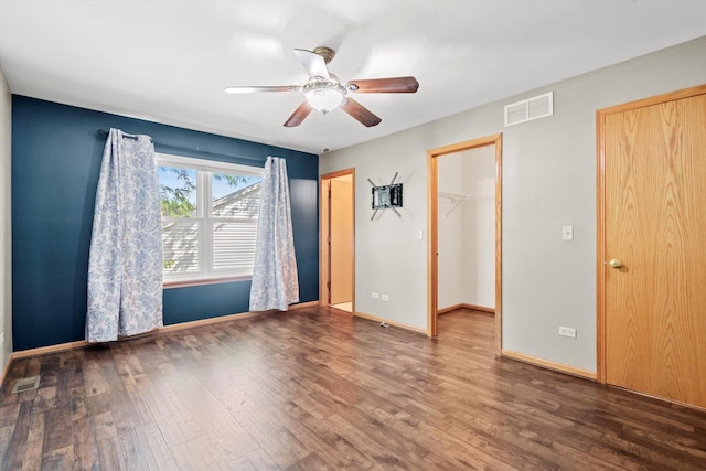 179 Briarcliff Ct, Romeoville, IL 60446 - unfurnished bedroom featuring wood finished floors, a ceiling fan, and a spacious closet