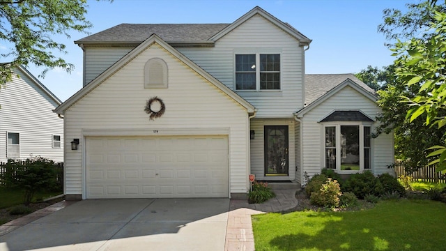 179 Briarcliff Ct, Romeoville, IL 60446 - traditional home featuring concrete driveway, a garage, roof with shingles, and a front yard