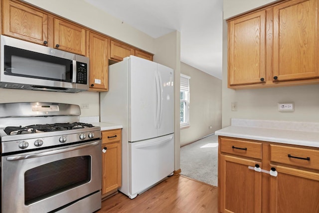 179 Briarcliff Ct, Romeoville, IL 60446 - kitchen featuring stainless steel appliances, light countertops, and light wood-style floors