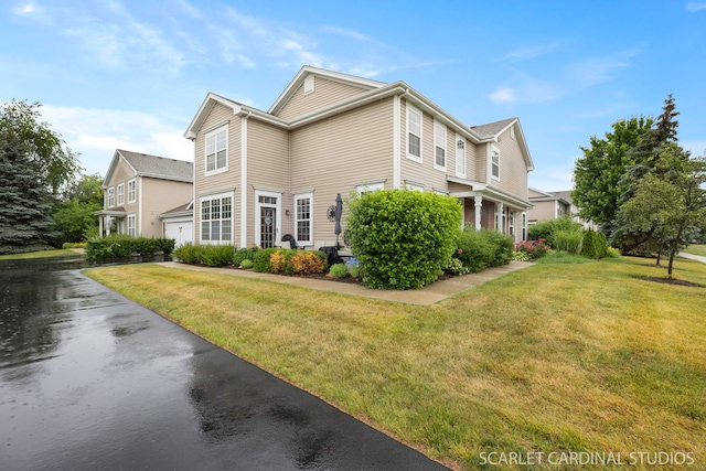 282 Whitfield Dr Unit A, Sugar Grove, IL 60554 - view of side of home featuring an attached garage, a lawn, and driveway