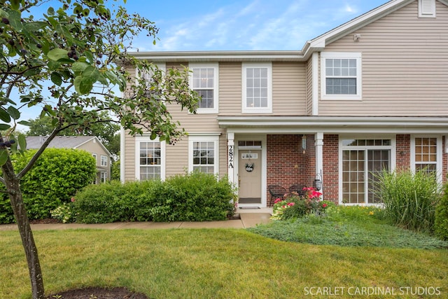 282 Whitfield Dr Unit A, Sugar Grove, IL 60554 - traditional-style house with a front lawn and brick siding