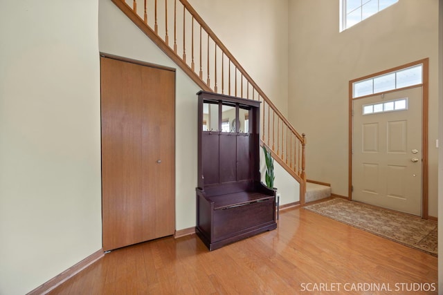282 Whitfield Dr Unit A, Sugar Grove, IL 60554 - entryway with wood finished floors, a high ceiling, plenty of natural light, and stairway