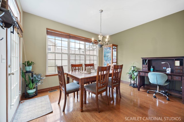 282 Whitfield Dr Unit A, Sugar Grove, IL 60554 - dining space featuring wood finished floors and a chandelier