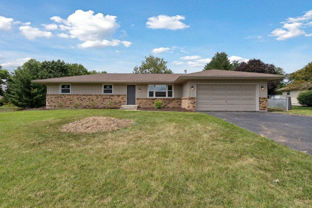 6282 Schaumburg Ln, Roscoe, IL 61073 - single story home with brick siding, an attached garage, driveway, and a front lawn
