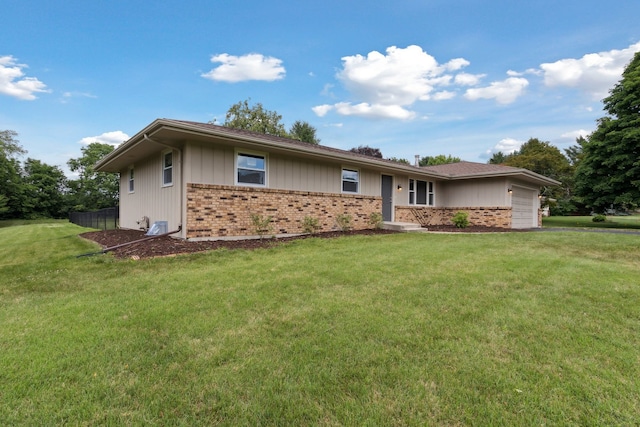 6282 Schaumburg Ln, Roscoe, IL 61073 - single story home with brick siding, a garage, and a front yard