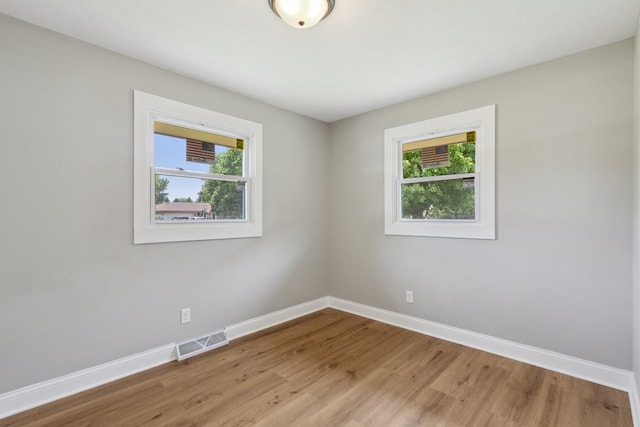 6282 Schaumburg Ln, Roscoe, IL 61073 - unfurnished room featuring plenty of natural light and light wood finished floors
