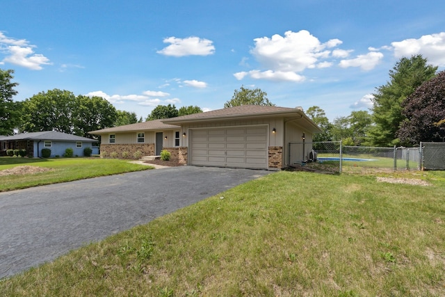 6282 Schaumburg Ln, Roscoe, IL 61073 - single story home with an attached garage, driveway, a gate, and brick siding