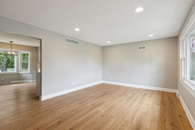 6282 Schaumburg Ln, Roscoe, IL 61073 - spare room featuring light wood finished floors, a chandelier, and recessed lighting