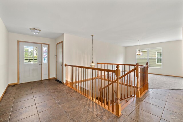 10961 Preston Pkwy, Huntley, IL 60142 - entryway featuring plenty of natural light, carpet floors, and tile patterned floors