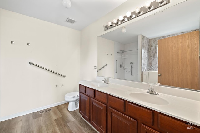 10961 Preston Pkwy, Huntley, IL 60142 - bathroom with double vanity, wood finished floors, and a shower