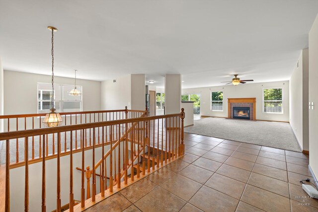 10961 Preston Pkwy, Huntley, IL 60142 - hallway with an upstairs landing, carpet flooring, and tile patterned floors
