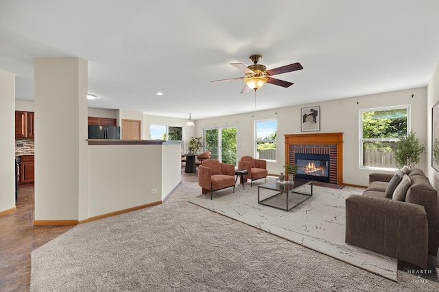10961 Preston Pkwy, Huntley, IL 60142 - living area with healthy amount of natural light, a fireplace, ceiling fan, and recessed lighting