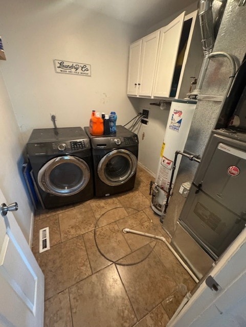5 Denham Dr, Montgomery, IL 60538 - washroom featuring washing machine and dryer, water heater, cabinet space, and tile patterned flooring