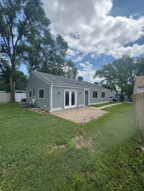 5 Denham Dr, Montgomery, IL 60538 - back of house with a fenced backyard, french doors, and a patio