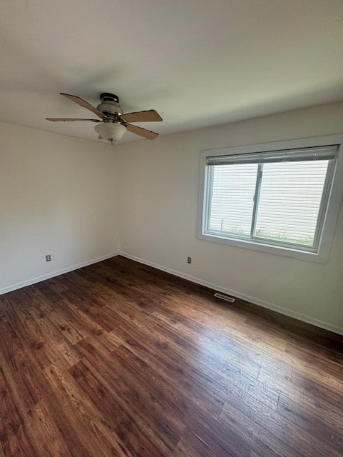 5 Denham Dr, Montgomery, IL 60538 - unfurnished room featuring dark wood-style flooring and ceiling fan