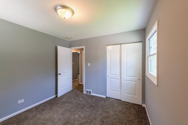 16955 Trapet Ave, Hazel Crest, IL 60429 - unfurnished bedroom featuring dark colored carpet and a closet