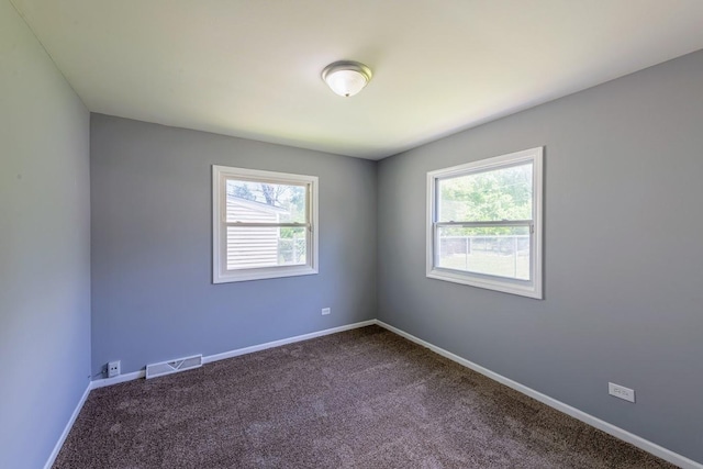 16955 Trapet Ave, Hazel Crest, IL 60429 - spare room with healthy amount of natural light and dark carpet