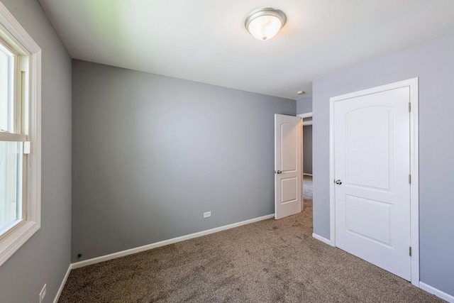 16955 Trapet Ave, Hazel Crest, IL 60429 - unfurnished bedroom featuring carpet flooring and multiple windows