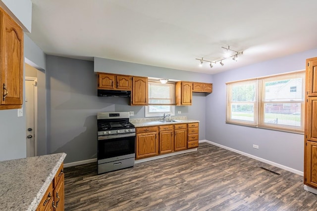 16955 Trapet Ave, Hazel Crest, IL 60429 - kitchen with stainless steel range with gas cooktop, under cabinet range hood, dark wood-type flooring, and healthy amount of natural light