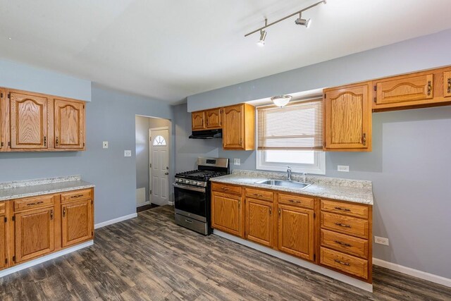 16955 Trapet Ave, Hazel Crest, IL 60429 - kitchen with gas stove, under cabinet range hood, dark wood-type flooring, light countertops, and brown cabinetry