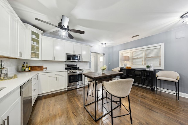 1636 W Huron St, Chicago, IL 60622 - kitchen with stainless steel appliances, white cabinetry, and dark wood-style flooring