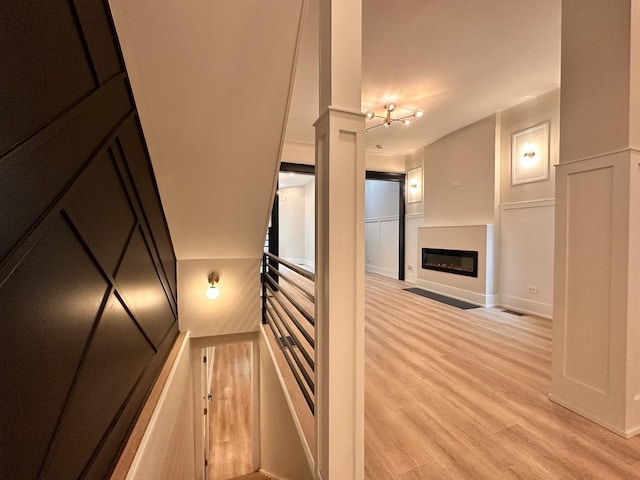 4409 S Prairie Ave, Chicago, IL 60653 - corridor featuring light wood-type flooring and a decorative wall