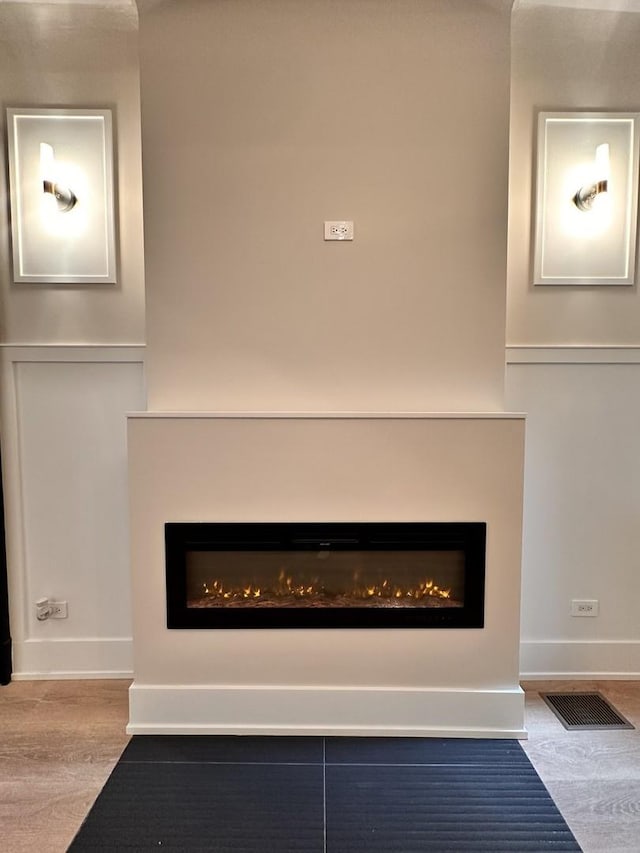 4409 S Prairie Ave, Chicago, IL 60653 - detailed view of a lit fireplace and wood finished floors
