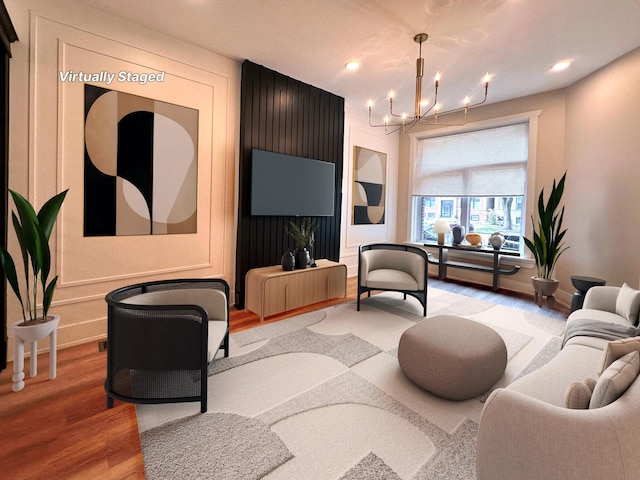 4409 S Prairie Ave, Chicago, IL 60653 - living room with light wood-style floors, a chandelier, and recessed lighting