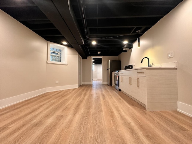 4409 S Prairie Ave, Chicago, IL 60653 - unfurnished living room with light wood-style floors and baseboards