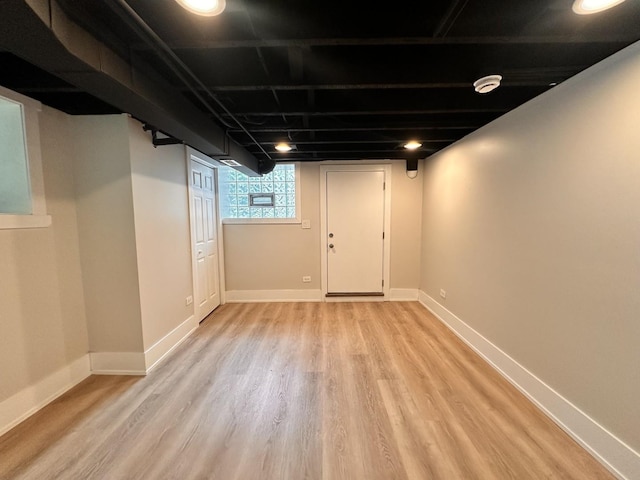 4409 S Prairie Ave, Chicago, IL 60653 - below grade area with light wood-style flooring and baseboards