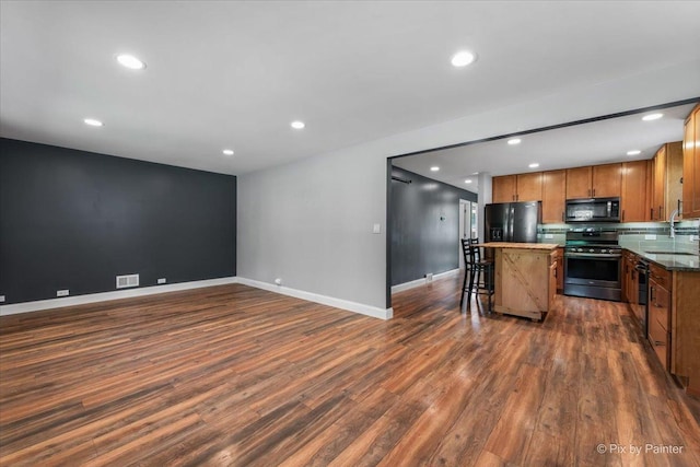 206 N Broadview Ave, Lombard, IL 60148 - kitchen featuring stainless steel range oven, black microwave, fridge with ice dispenser, a kitchen island, and recessed lighting