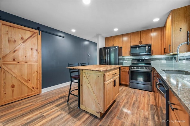 206 N Broadview Ave, Lombard, IL 60148 - kitchen with stainless steel range, black fridge, dishwasher, light wood-type flooring, and backsplash