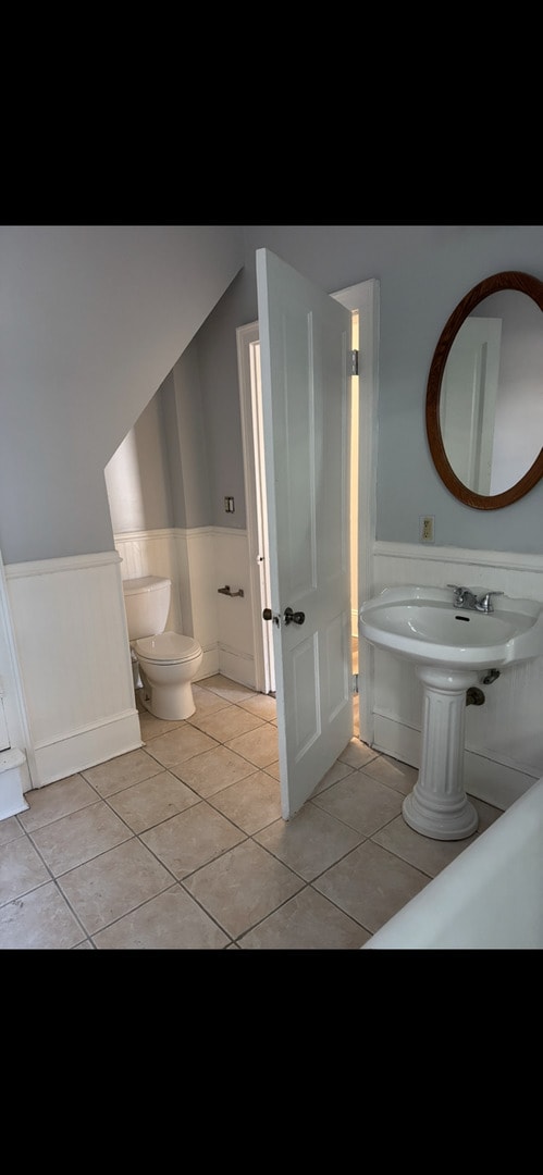 211 E Mulberry St, Bloomington, IL 61701 - bathroom with wainscoting and tile patterned floors