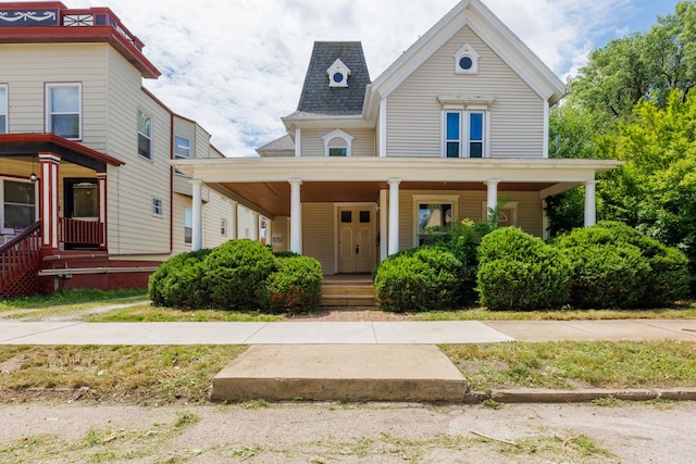 211 E Mulberry St, Bloomington, IL 61701 - victorian house featuring covered porch and roof with shingles