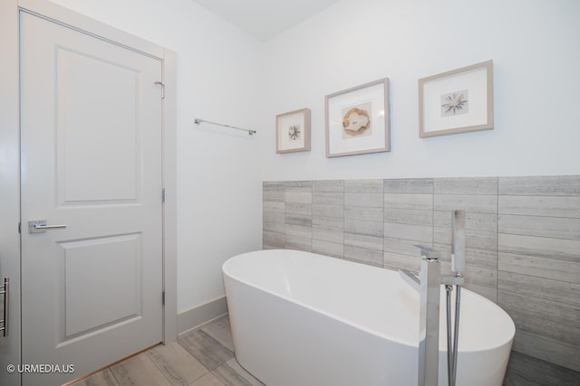 1221 E 46th St Unit 1, Chicago, IL 60653 - full bathroom featuring a soaking tub and tile walls