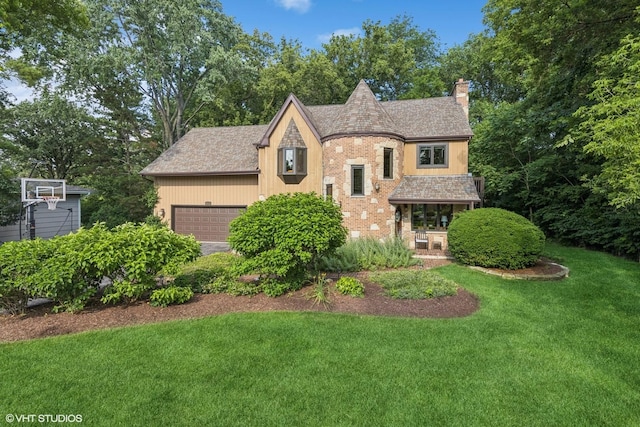 5525 Lee Ave, Downers Grove, IL 60515 - english style home featuring a chimney, a front lawn, and a garage