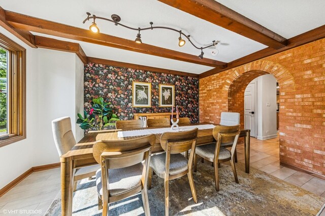 5525 Lee Ave, Downers Grove, IL 60515 - dining area with light tile patterned flooring, brick wall, arched walkways, and beam ceiling