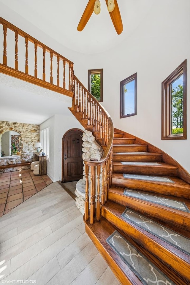 5525 Lee Ave, Downers Grove, IL 60515 - stairs featuring a ceiling fan, wood finished floors, and arched walkways