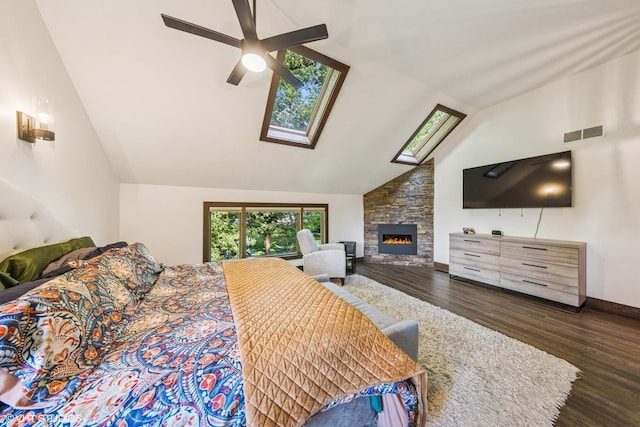 5525 Lee Ave, Downers Grove, IL 60515 - bedroom featuring wood finished floors, high vaulted ceiling, a stone fireplace, a skylight, and a ceiling fan