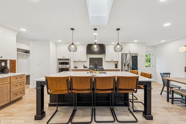 5525 Lee Ave, Downers Grove, IL 60515 - kitchen featuring stainless steel appliances, backsplash, a breakfast bar, recessed lighting, and custom range hood