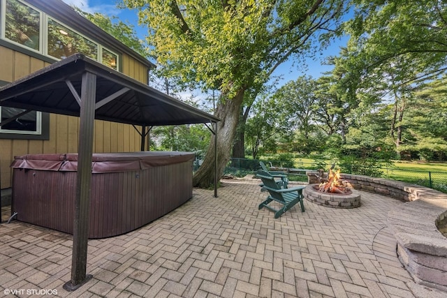 5525 Lee Ave, Downers Grove, IL 60515 - view of patio with a hot tub and an outdoor fire pit